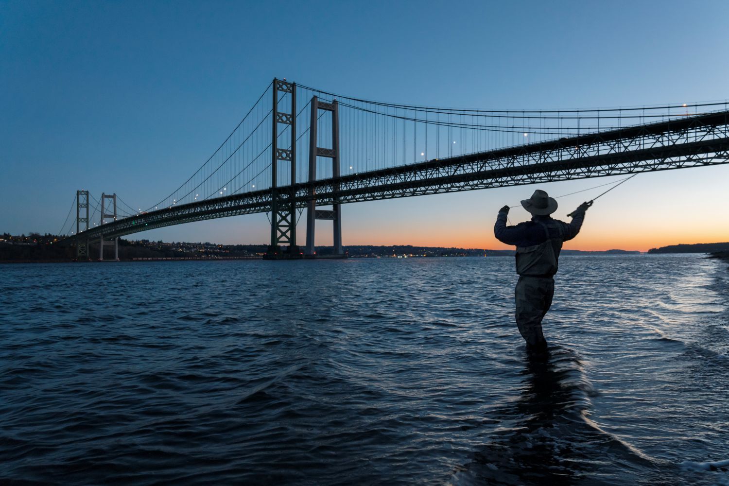 Man fishing in Puget Sound near Tacoma, WA